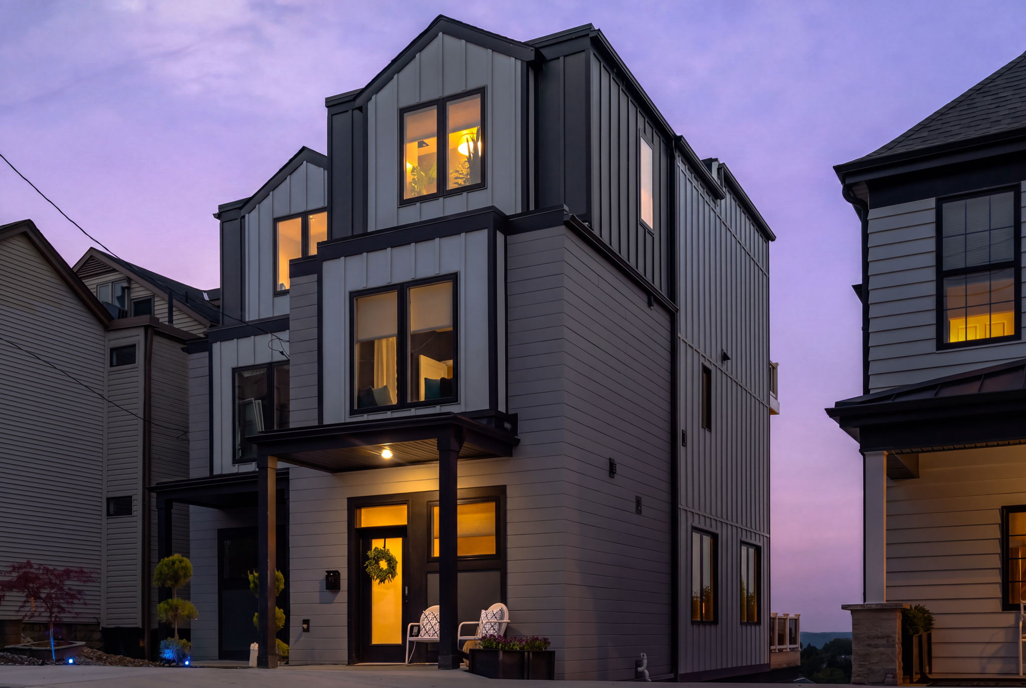 Completed exterior of 132 Prospect Street at dusk on Mount Washington