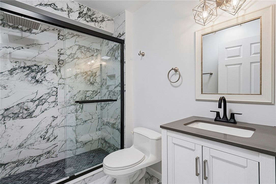 3354 Ridgway Street · Expressive tile and black fixtures
